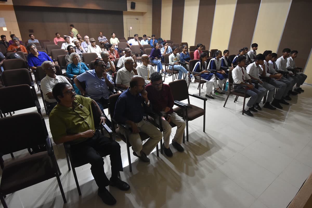 An audience seated for a public lecture